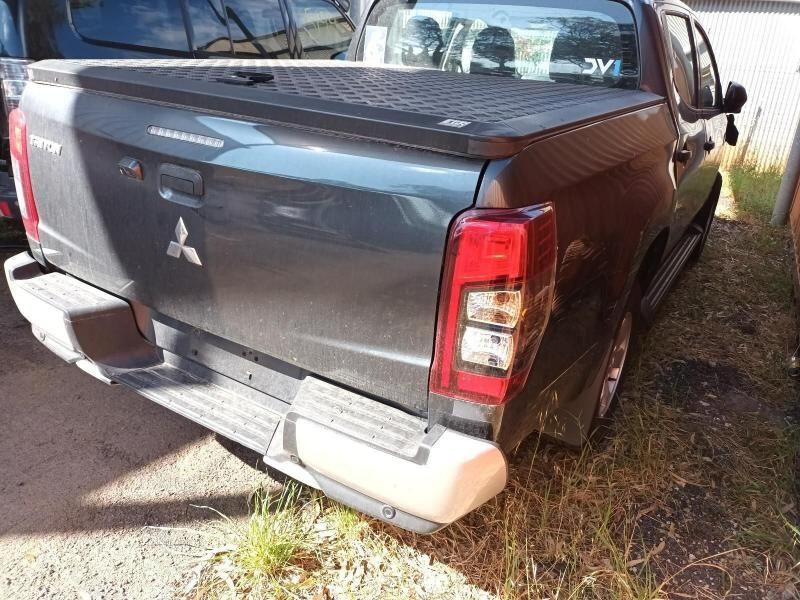 The Back End of a Mitsubishi Triton Pickup Truck is Shown — South West 4WD Wreckers In Brisbane, QLD