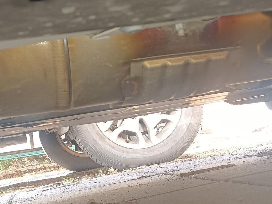 A Close Up of the Underside of a Car with a Tire — South West 4WD Wreckers In Brisbane, QLD 