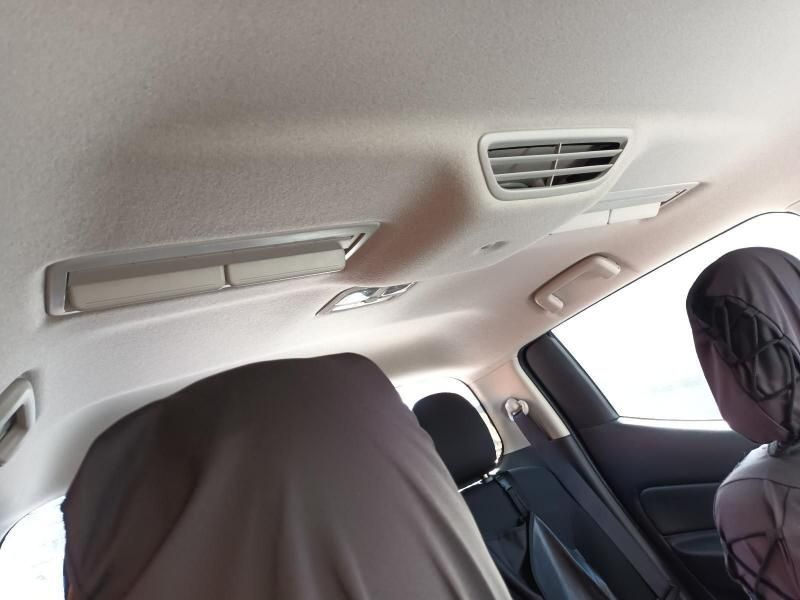 A Woman is Sitting in the Back Seat of a Car — South West 4WD Wreckers In Brisbane, QLD