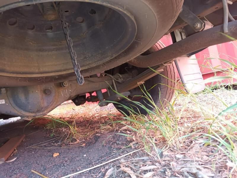 A Close Up of the Underside of a Car With Grass Growing Out of It — South West 4WD Wreckers In Brisbane, QLD