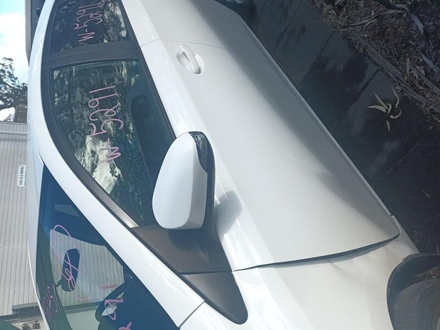 A White Car with the Word Sell Written on the Side — South West 4WD Wreckers In Brisbane, QLD