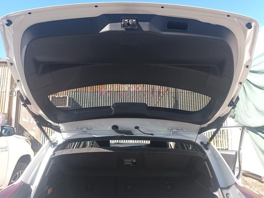 The Back of a White Car with the Trunk Open — South West 4WD Wreckers In Brisbane, QLD