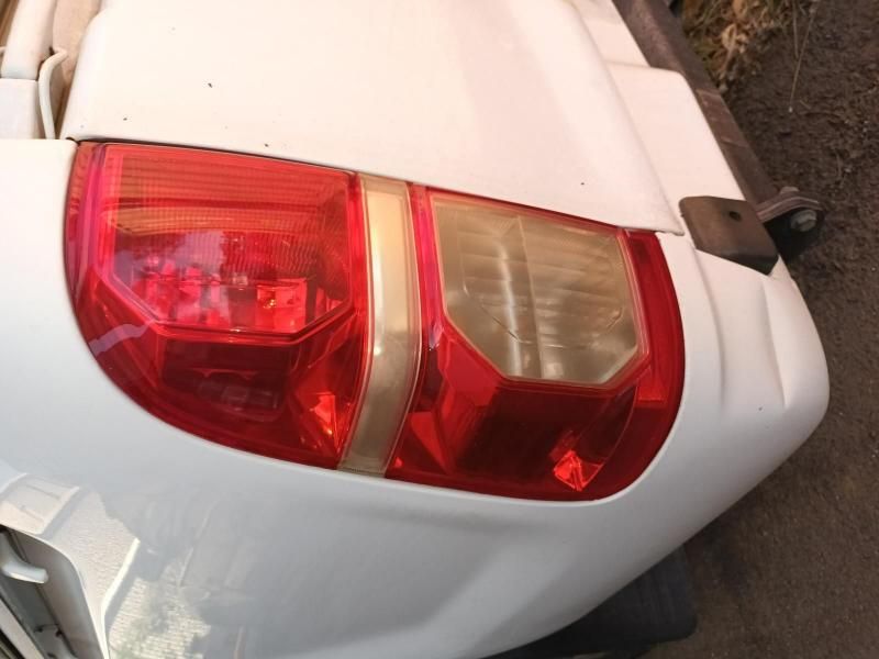 A White Car With a Red Tail Light on It — South West 4WD Wreckers In Brisbane, QLD