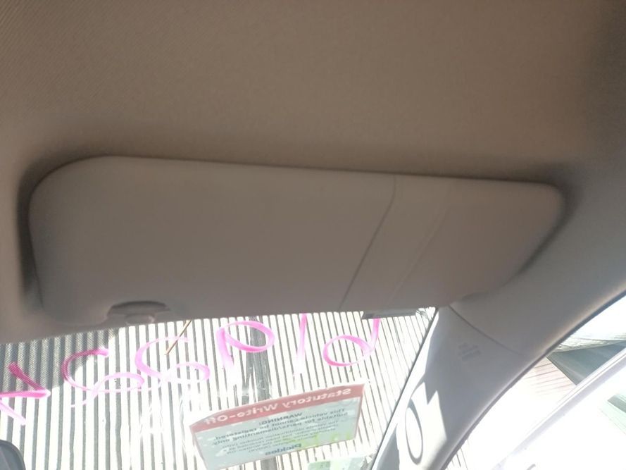 A Sun Visor is Hanging from the Ceiling of a Car — South West 4WD Wreckers In Brisbane, QLD