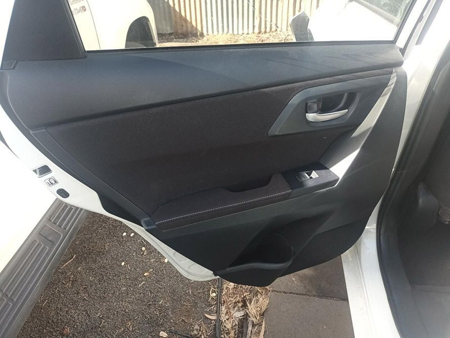 The Back Door of a White Car with the Door Open — South West 4WD Wreckers In Brisbane, QLD