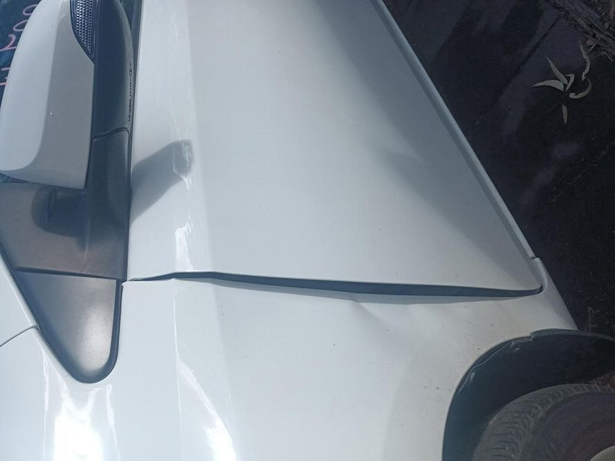 A Close Up of a White Car with a Damaged Fender — South West 4WD Wreckers In Brisbane, QLD