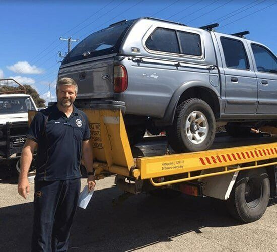 A Blue Suv With a Snorkel is Parked in a Dirt Lot — South West 4WD Wreckers In Harristown, QLD