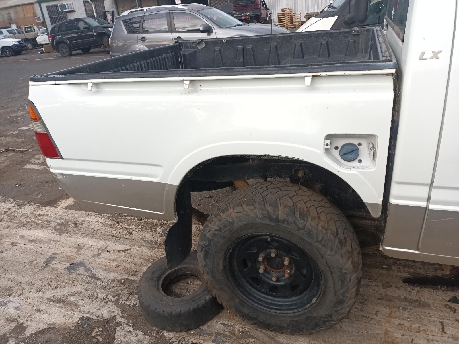 Rear Side View of a White Pickup Truck