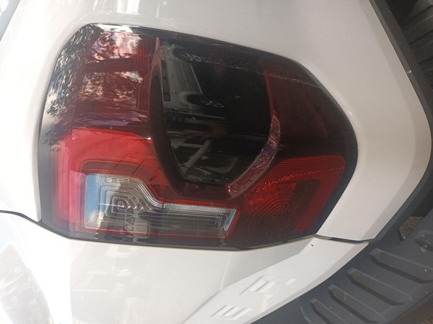 A Close Up of a White Car's Tail Light — South West 4WD Wreckers In Brisbane, QLD