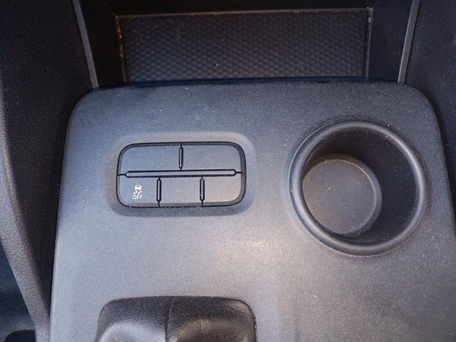 A Close Up of a Car Console with a Cup Holder and a Button — South West 4WD Wreckers In Brisbane, QLD