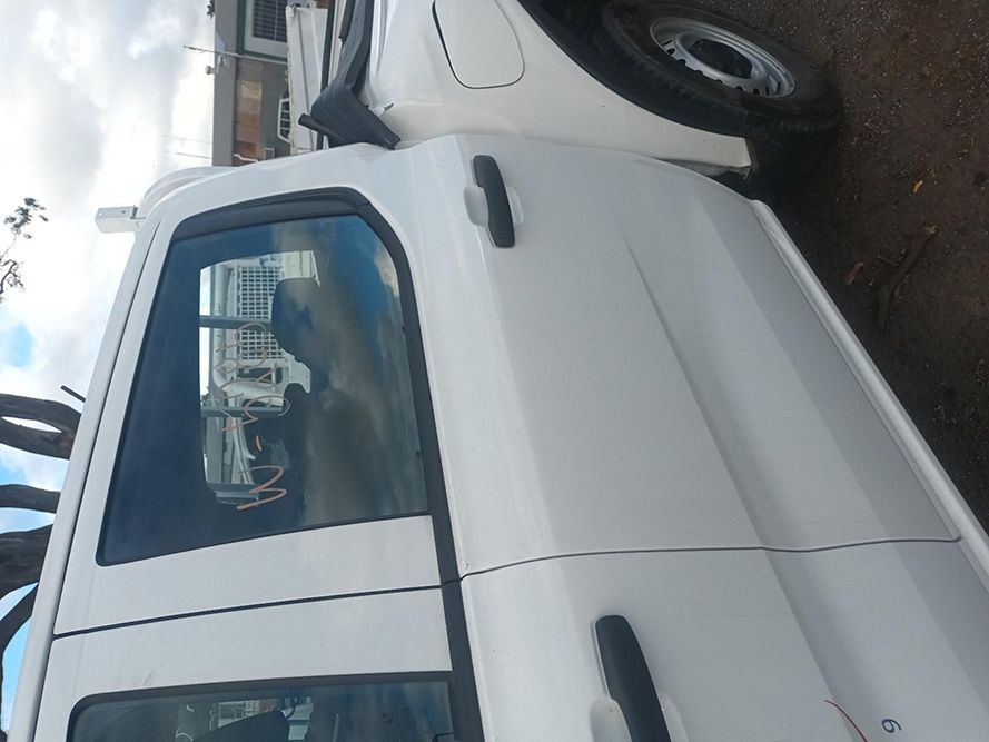 A White Truck is Parked on the Side of the Road — South West 4WD Wreckers In Brisbane, QLD
