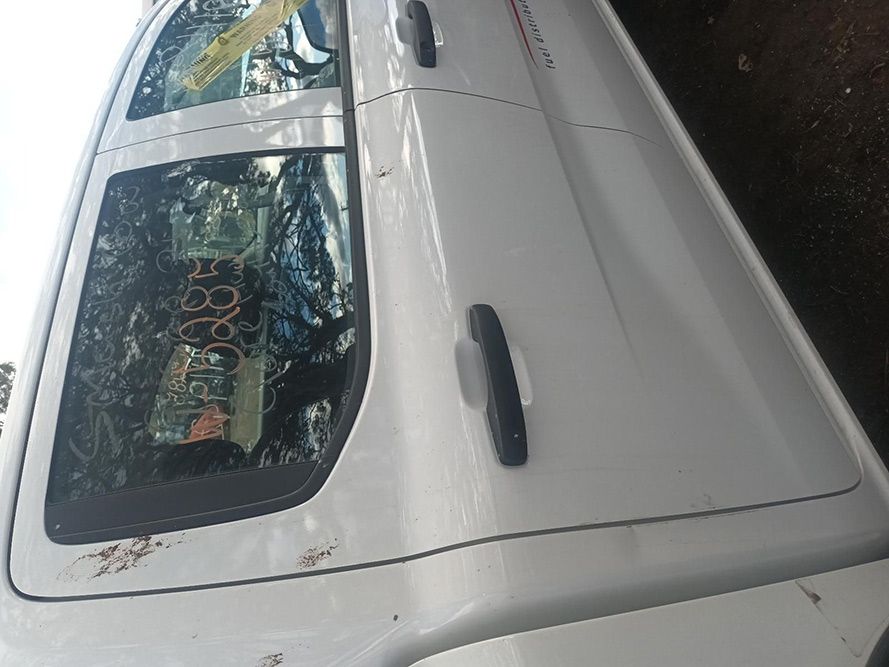 A White Truck is Parked on the Side of the Road — South West 4WD Wreckers In Brisbane, QLD