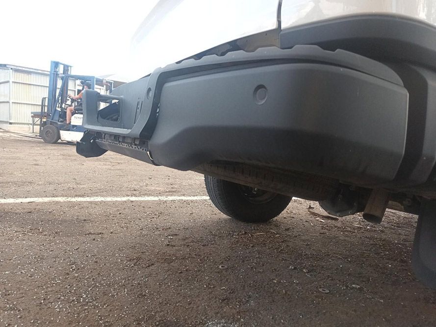 A White Truck with a Black Bumper is Parked in a Parking Lot — South West 4WD Wreckers In Brisbane, QLD