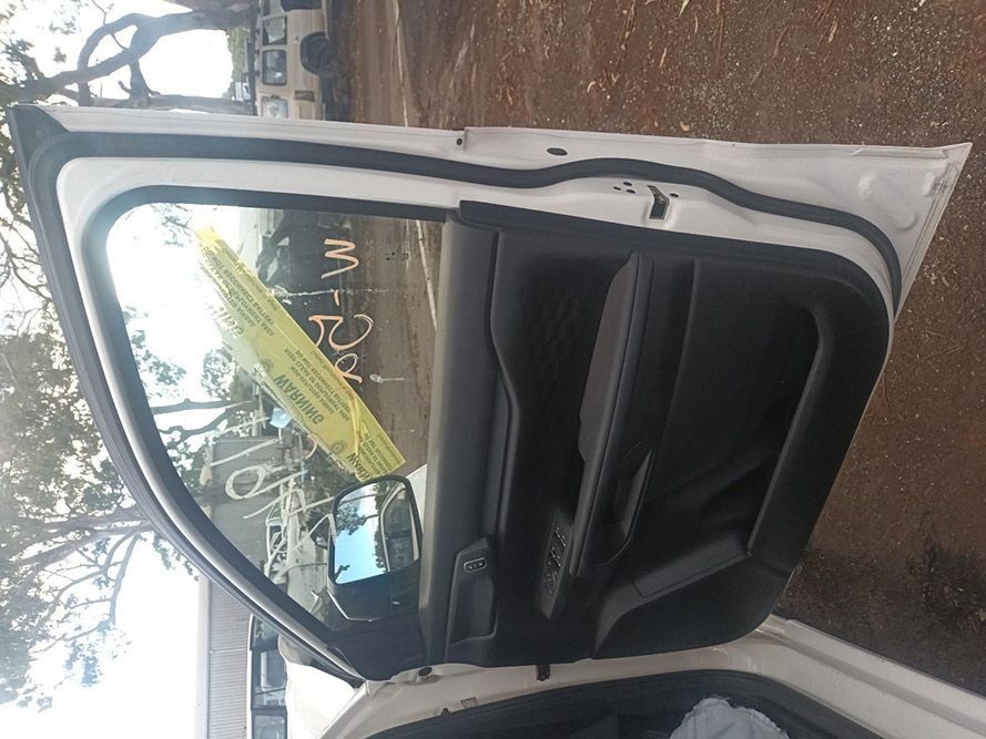 A White Car with the Door Open and a Yellow Tag on the Windshield — South West 4WD Wreckers In Brisbane, QLD