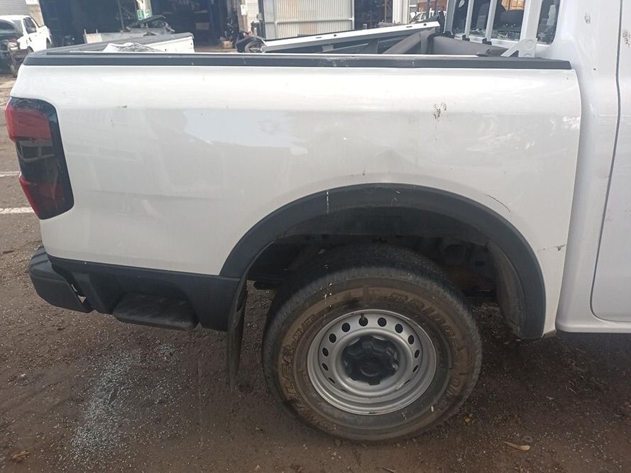 A White Truck is Parked on the Side of the Road — South West 4WD Wreckers In Brisbane, QLD