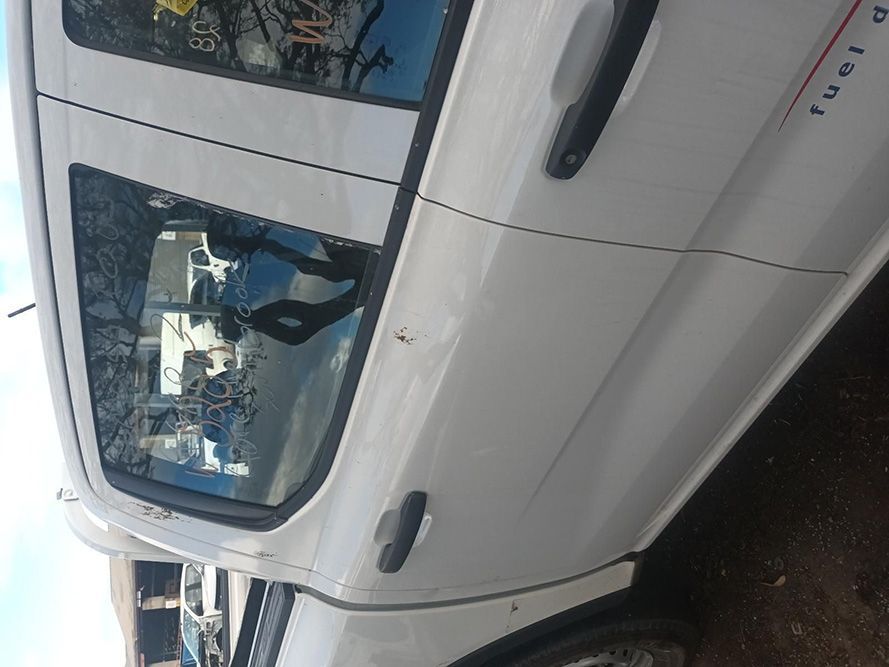 A White Truck is Parked on the Side of the Road — South West 4WD Wreckers In Brisbane, QLD