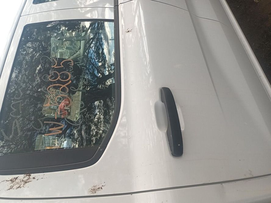 A White Car Side View in a Parking Lot — South West 4WD Wreckers In Brisbane, QLD