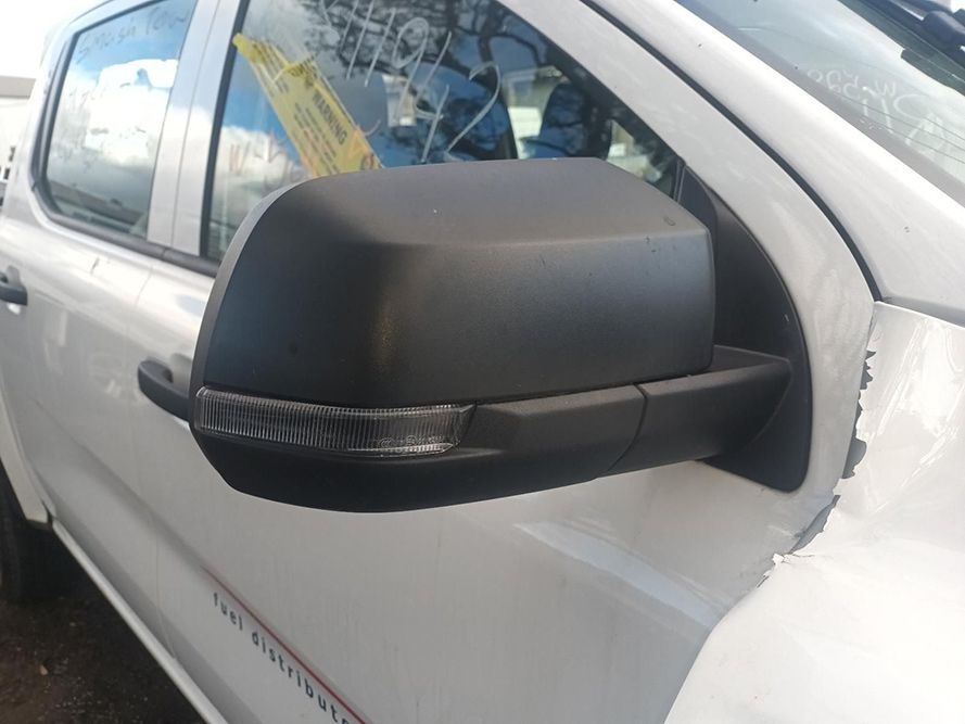 A White Truck with Black Side Mirrors is Parked on the Side of the Road — South West 4WD Wreckers In Brisbane, QLD