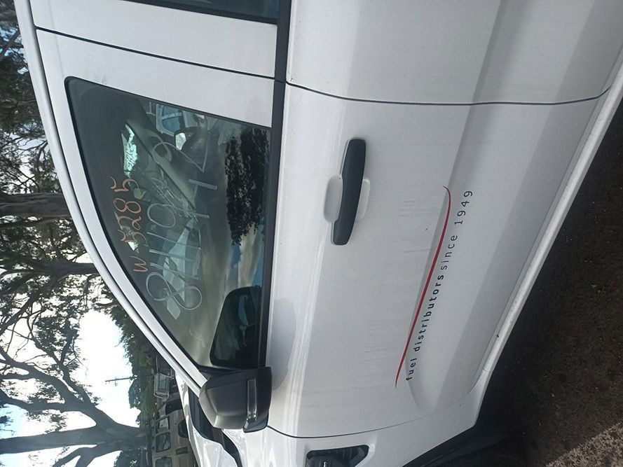 A White Truck is Parked on the Side of the Road — South West 4WD Wreckers In Brisbane, QLD