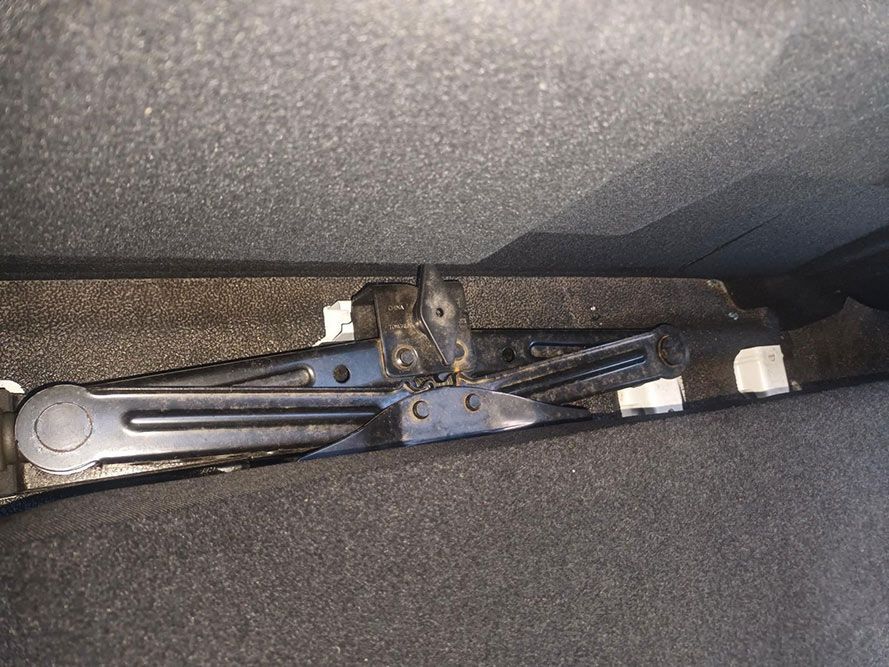 A Jack is Sitting in the Trunk of a Car — South West 4WD Wreckers In Brisbane, QLD