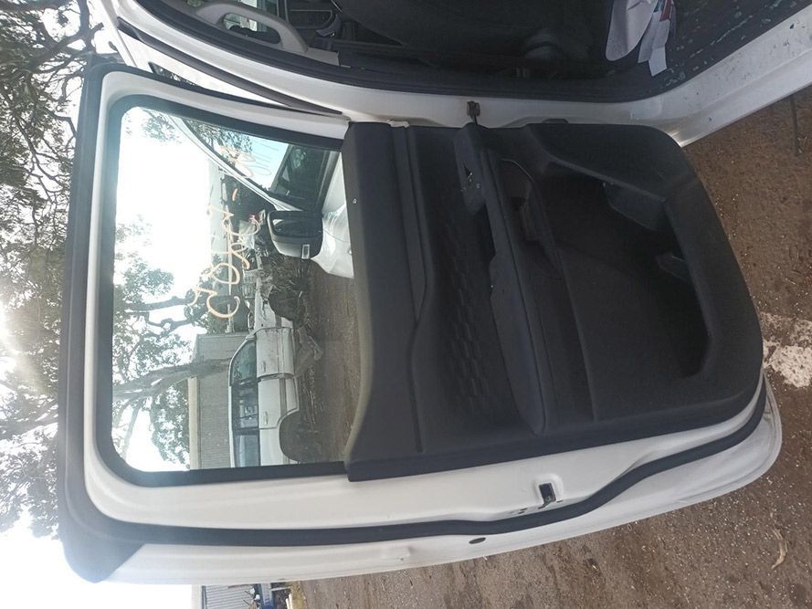 The Back Door of a White Car is Open — South West 4WD Wreckers In Brisbane, QLD