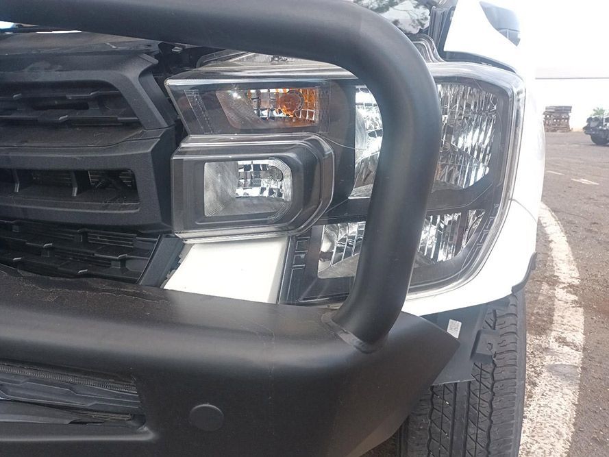 A White Truck with a Black Bumper is Parked in a Parking Lot — South West 4WD Wreckers In Brisbane, QLD