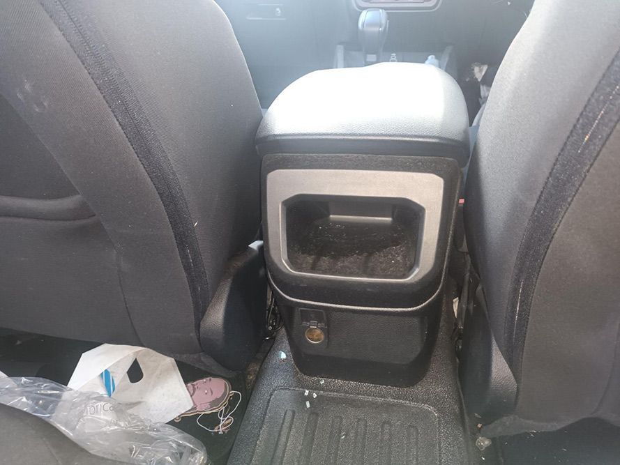 A Trash Can is Sitting in the Back Seat of a Car — South West 4WD Wreckers In Brisbane, QLD