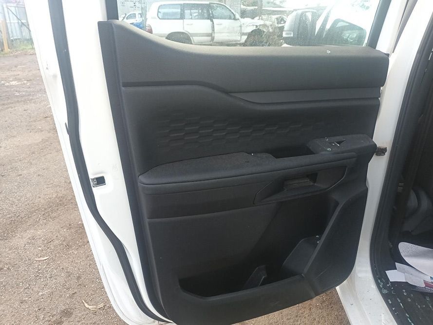 The Inside of a White Car with the Door Open — South West 4WD Wreckers In Brisbane, QLD