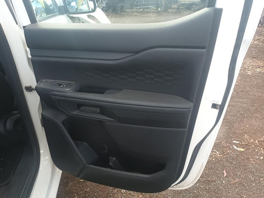 A White Car with the Door Open is Parked on a Dirt Road — South West 4WD Wreckers In Brisbane, QLD