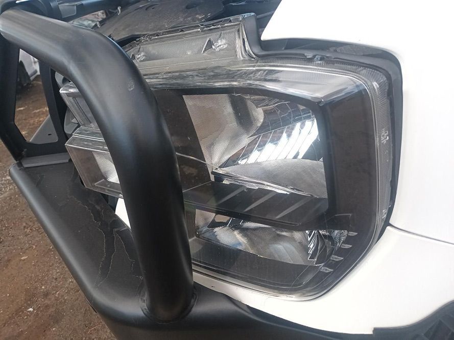 A Close Up of a Car's Headlight with a Black Bumper — South West 4WD Wreckers In Brisbane, QLD