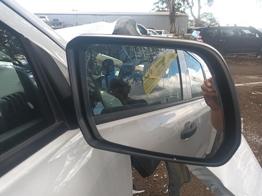 A Close Up of a Side View Mirror on a White Car — South West 4WD Wreckers In Brisbane, QLD