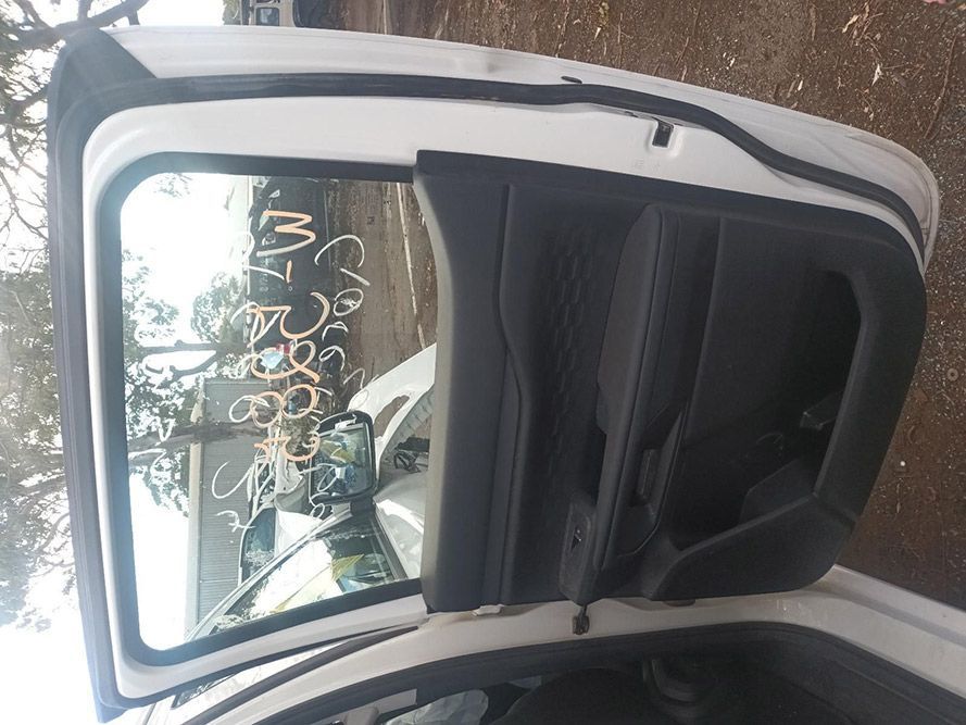 The Back Door of a White Car with the Door Open — South West 4WD Wreckers In Brisbane, QLD