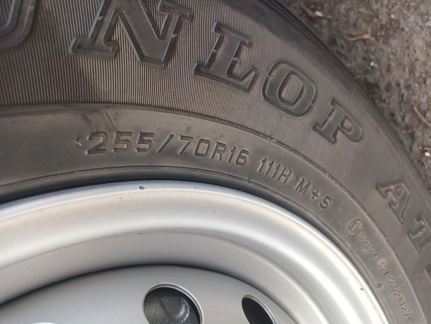 A Close Up of a Tire That Says Dunlop on It — South West 4WD Wreckers In Brisbane, QLD