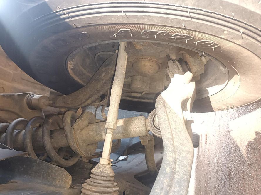 A Close Up of the Underside of a Car with a Tire on It — South West 4WD Wreckers In Brisbane, QLD