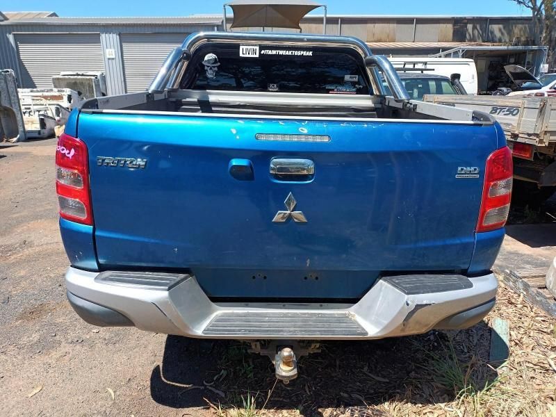 A Mitsubishi Triton Truck is Parked in a Parking Lot — South West 4WD Wreckers In Brisbane, QLD