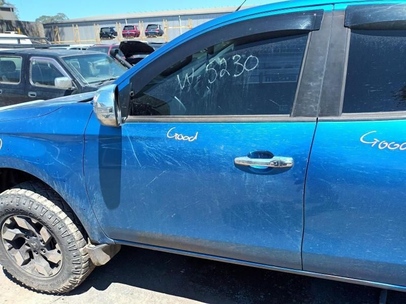 A Blue Car With the Word Cross Written on the Door — South West 4WD Wreckers In Brisbane, QLD