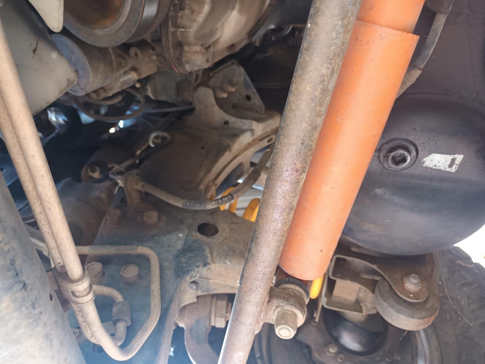 A Close Up of the Underside of a Car with a Shock Absorber — South West 4WD Wreckers In Brisbane, QLD