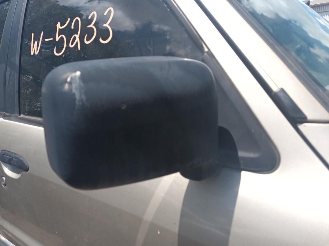 A Silver Car with the Number W-5233 on the Side — South West 4WD Wreckers In Brisbane, QLD