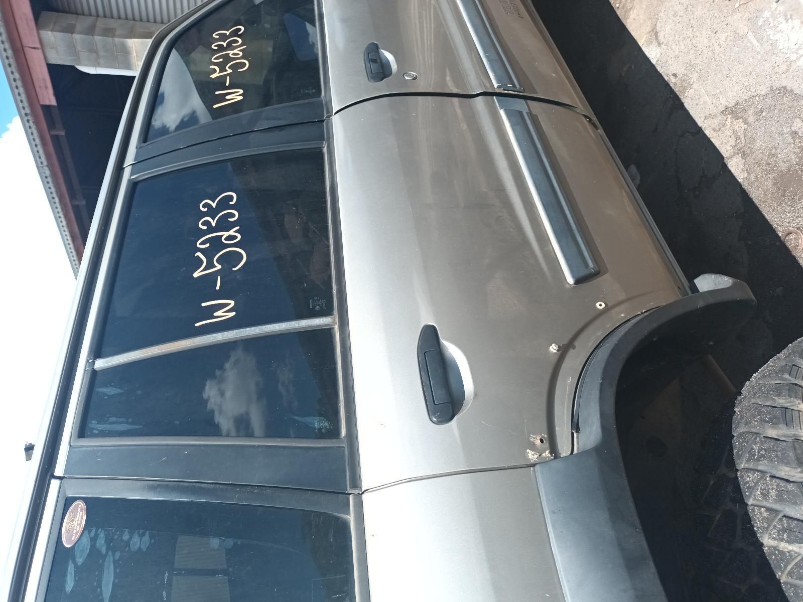 A Silver Car with the License Plate W-5233 — South West 4WD Wreckers In Brisbane, QLD