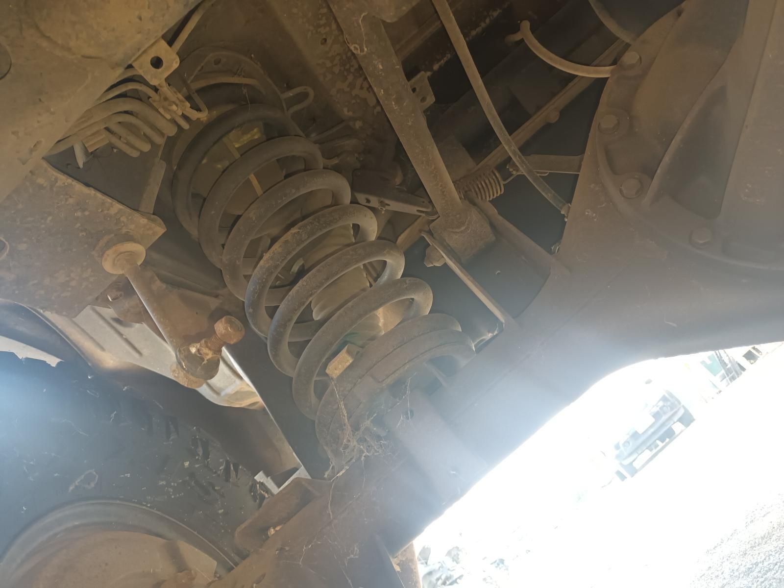 A Close Up of a Shock Absorber on the Underside of a Car — South West 4WD Wreckers In Brisbane, QLD