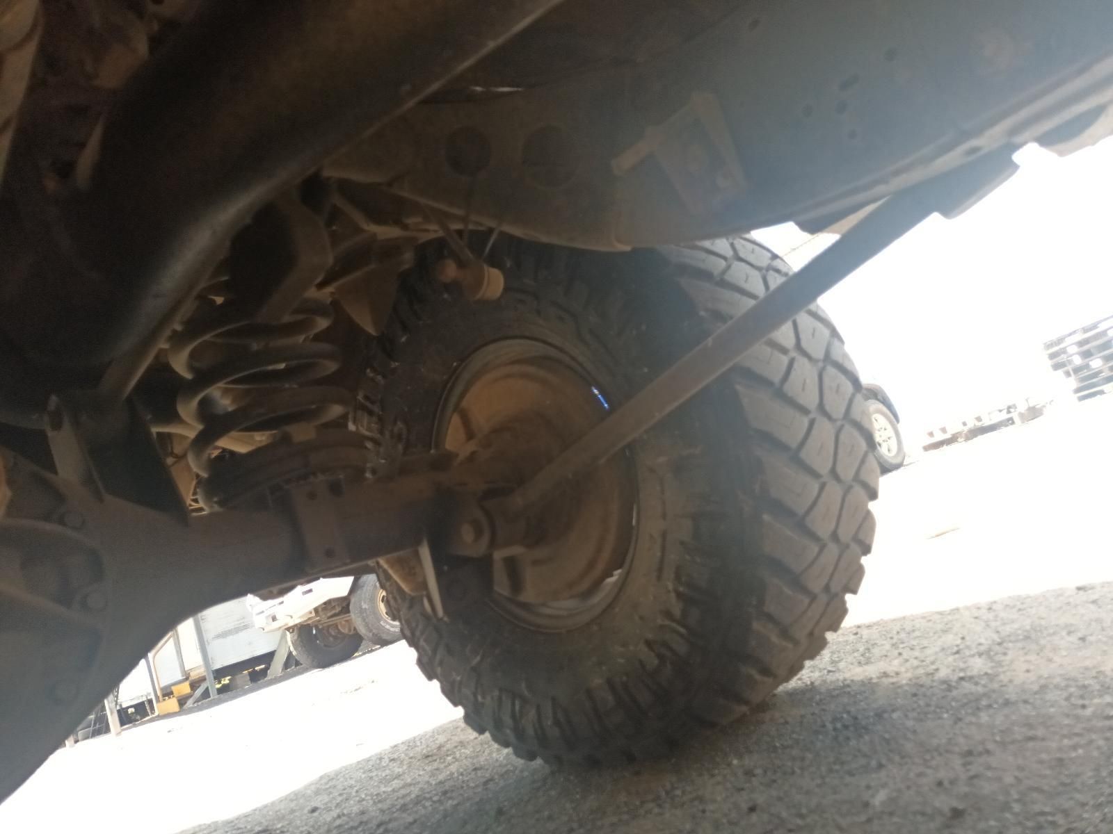 The Underside of a Truck with a Large Tire — South West 4WD Wreckers In Brisbane, QLD
