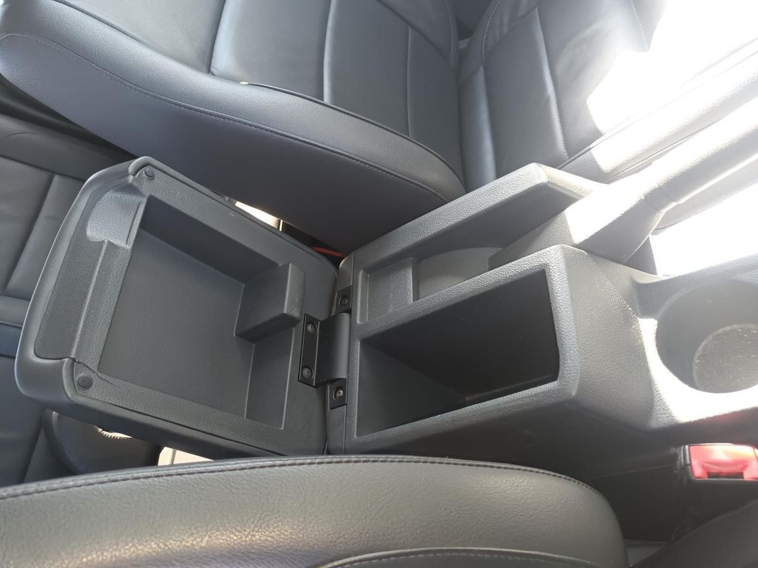 A Car Console with the Lid Open and a Cup Holder — South West 4WD Wreckers In Brisbane, QLD