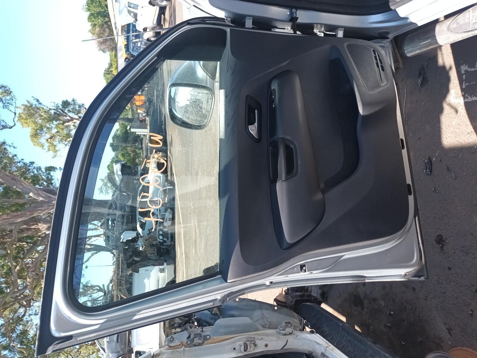 The Door of a Car is Open and Sitting on the Ground — South West 4WD Wreckers In Brisbane, QLD