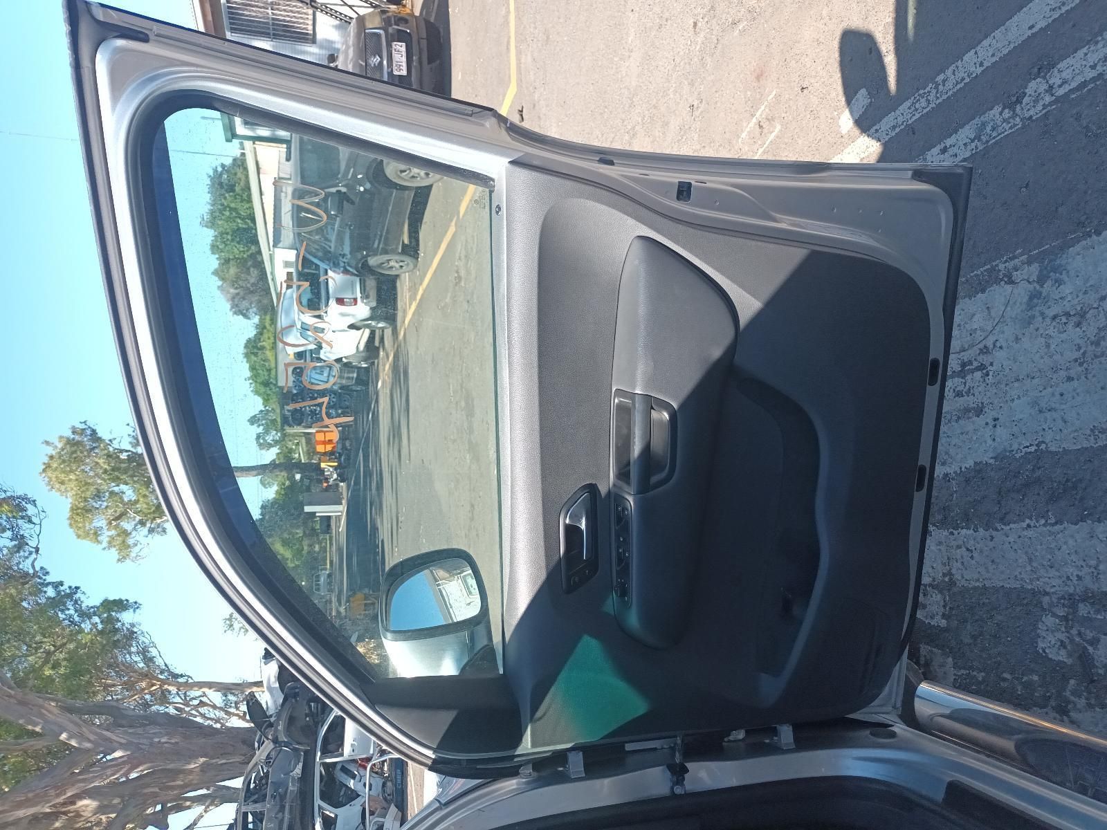 A Car is Parked in a Parking Lot with the Door Open — South West 4WD Wreckers In Brisbane, QLD
