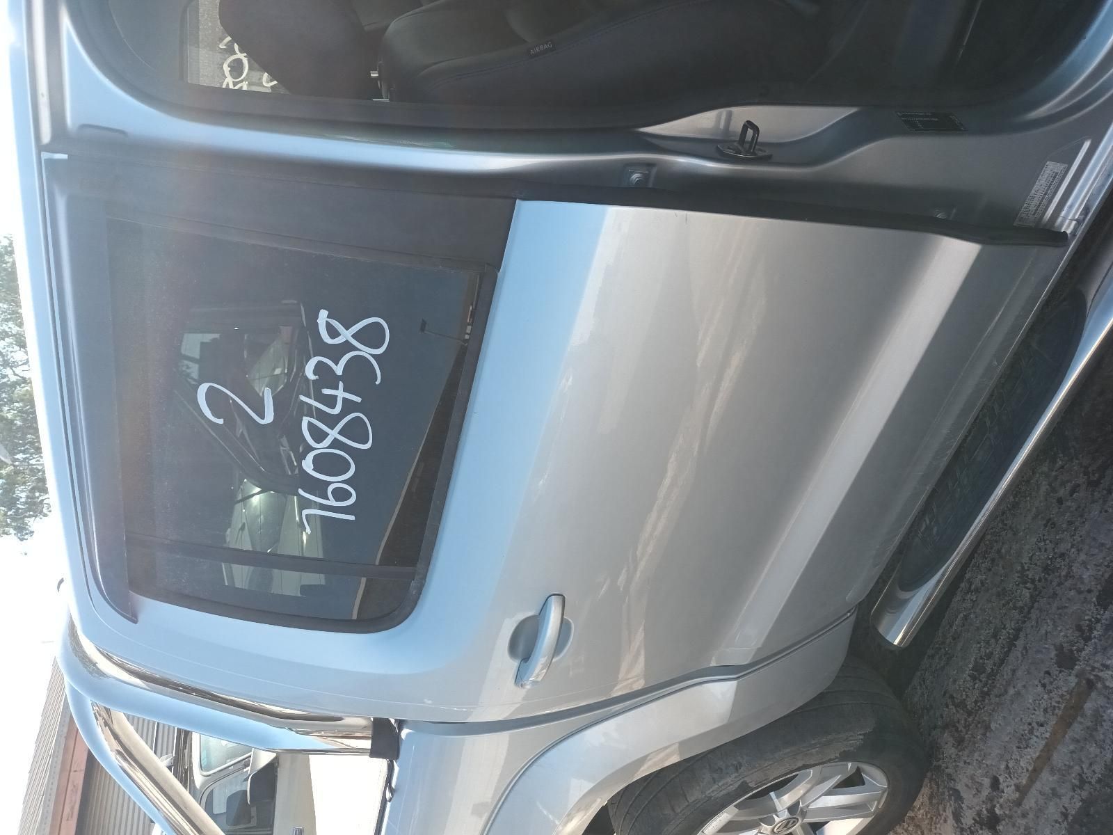 A Silver Car with the Numbers Written on the Door — South West 4WD Wreckers In Brisbane, QLD