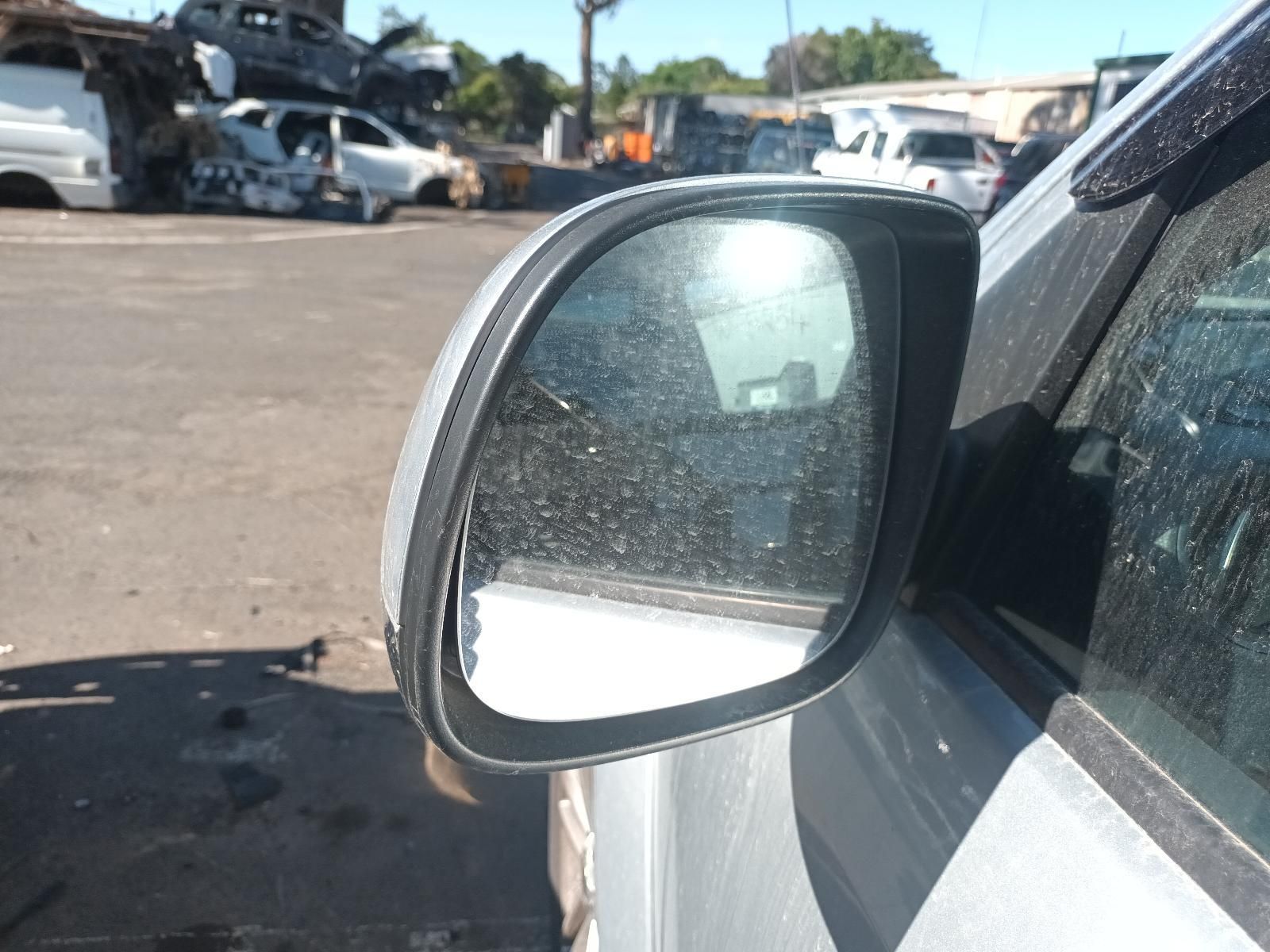 A Silver Car is Parked in a Parking Lot with a Lot of Cars in the Background — South West 4WD Wreckers In Brisbane, QLD