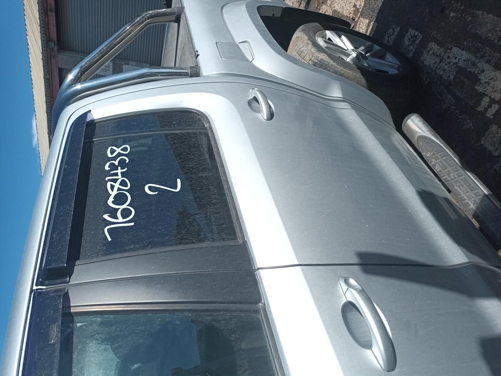A Silver Car with the Numbers Written on the Door — South West 4WD Wreckers In Brisbane, QLD