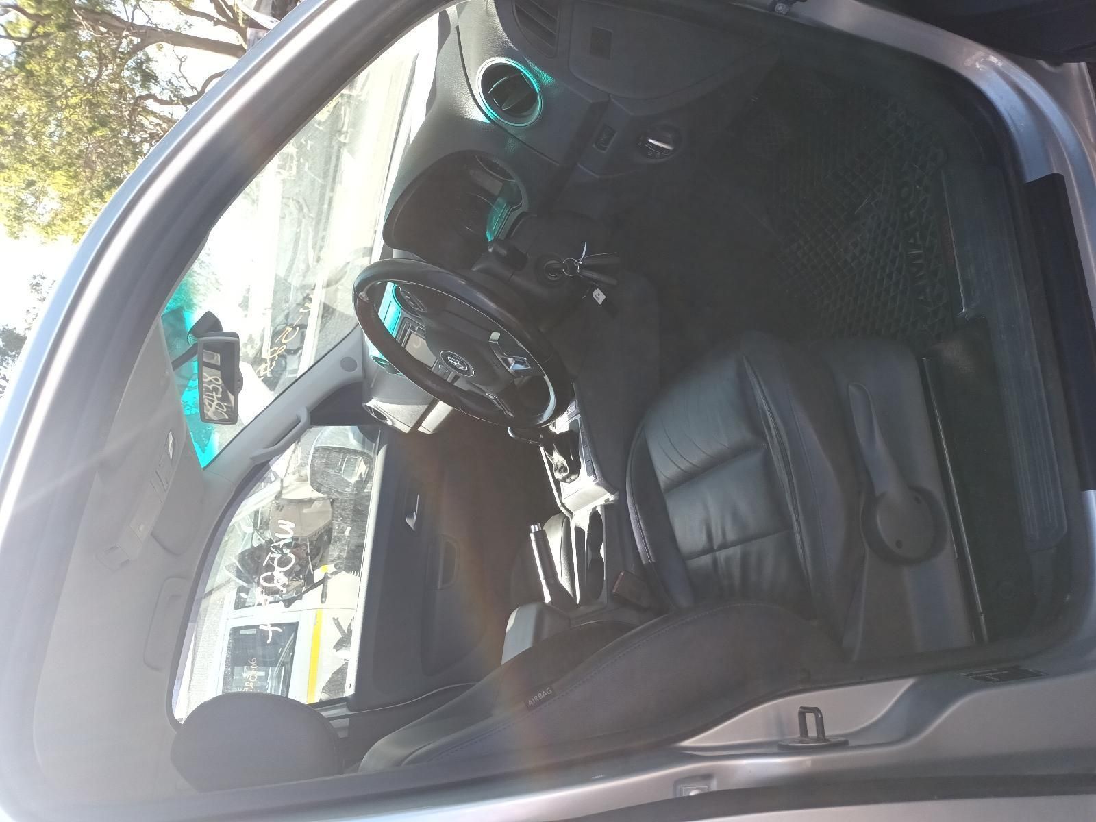 A Car is Parked with the Door Open and the Steering Wheel is Visible — South West 4WD Wreckers In Brisbane, QLD