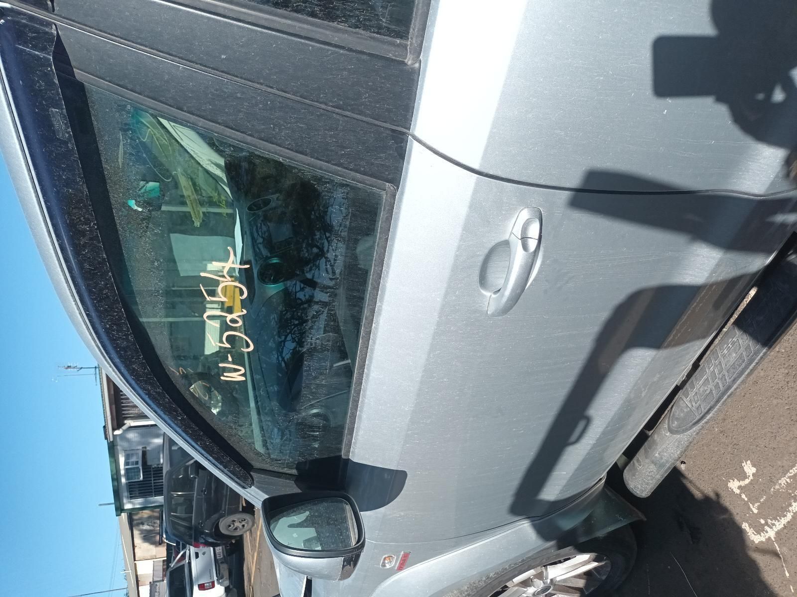 A Silver Car is Parked on the Side of the Road — South West 4WD Wreckers In Brisbane, QLD