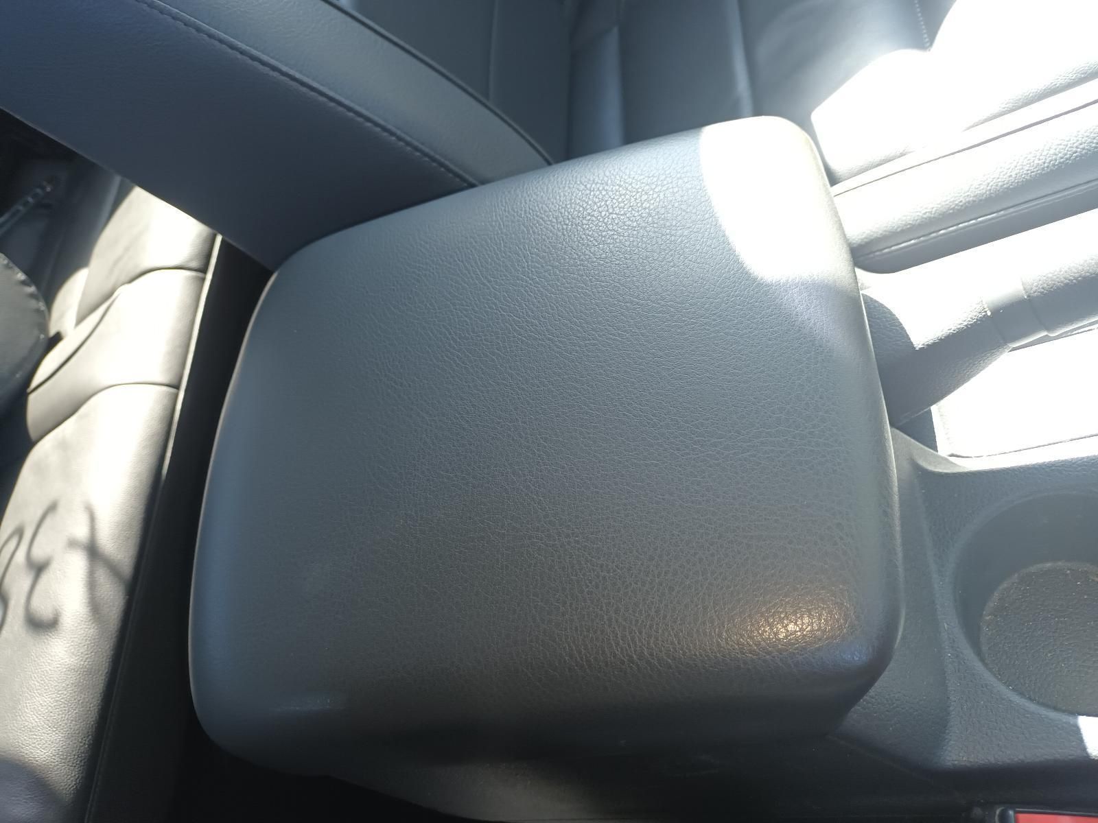 A Black Arm Rest in a Car with a Cup Holder — South West 4WD Wreckers In Brisbane, QLD
